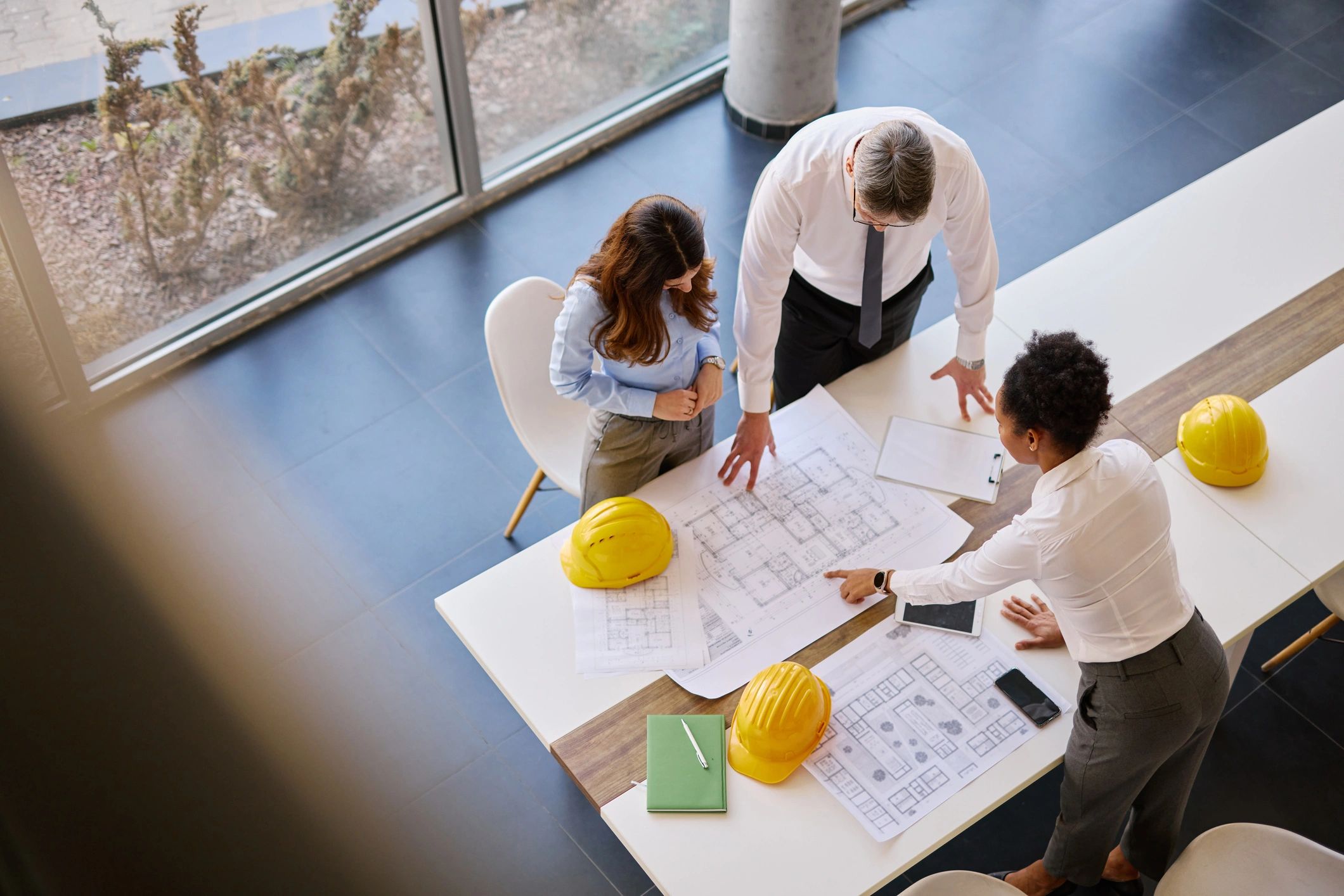 Architects reviewing plans in a collaborative office